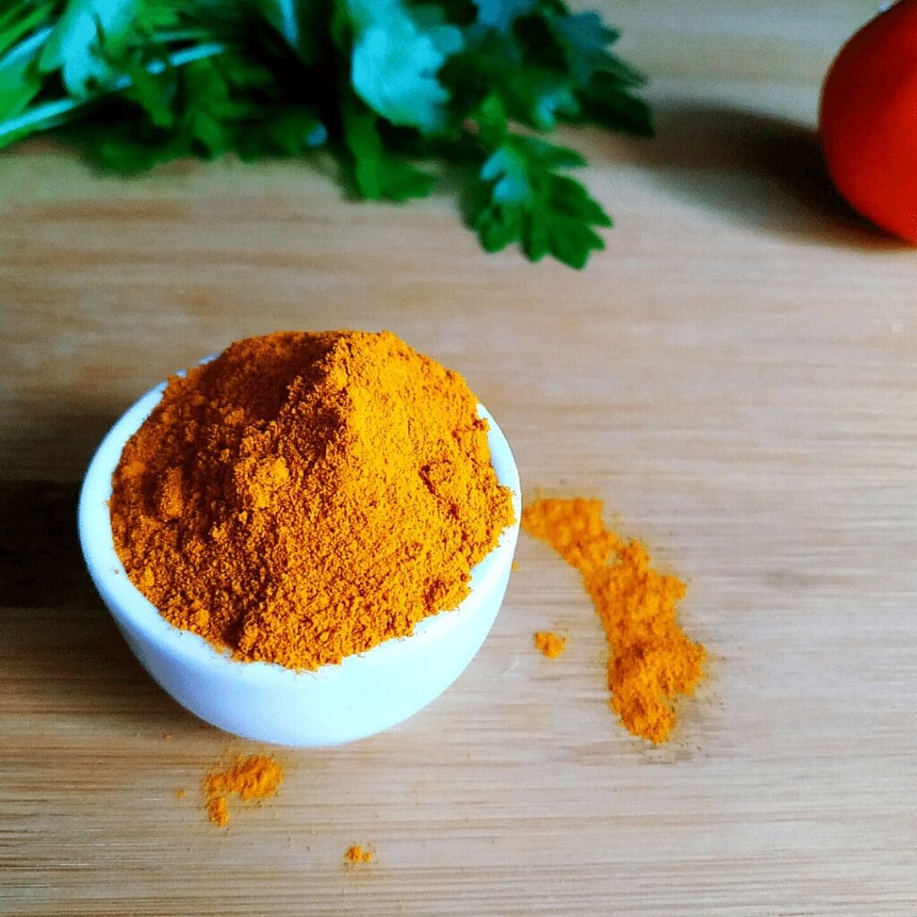 #18 on our List of Spices is Turmeric, a yellow spice in a ceramic cup